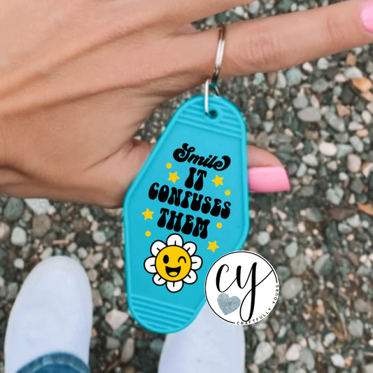 "Smile, It Confuses Them" Retro Motel Keychain