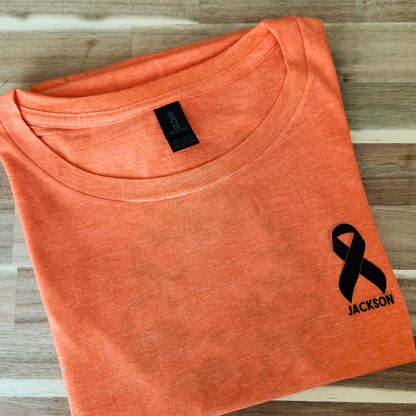 🦕 Jackson Ribbon Awareness Tee – Dinosaurs for a Cause